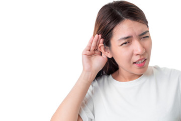 Fototapeta premium Asian woman wear white t-shirt hearing loss or hard of hearing and cupping her hand behind her ear isolate on white background , Deaf concept.