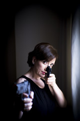 Portrait of woman with gun