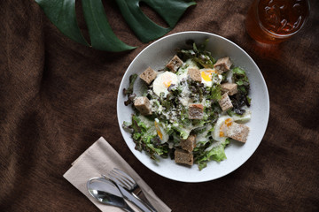 caesar salad appetizer on wooden background