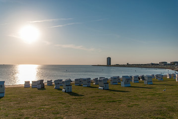 Wide view over the beach and dike of Buesum on a summer evening.