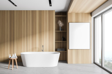 Naklejka na ściany i meble White and wooden bathroom with tub and poster
