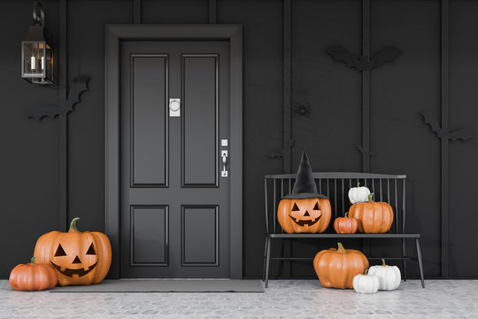 Black House Door With Carved Pumpkins