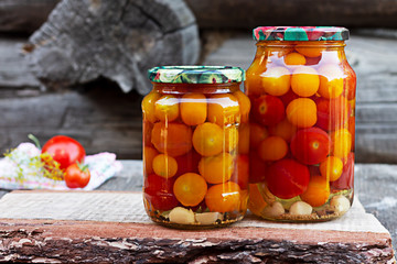 Tomatoes in a glass jar, homemade pickles