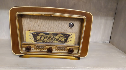 Yellow and brown antique radio relic, Huesca, Spain.