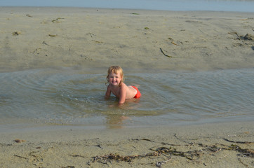 caucasian child 2 years old on the beach in summer vacation