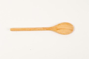 Wooden spoon placed on a white background