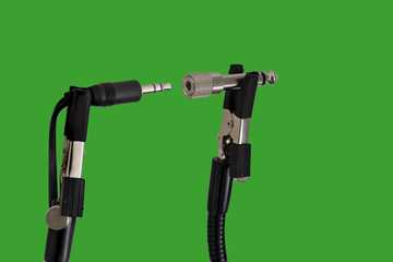 Chroma key background with male and female 3.5 to 5mm audio jack connector adaptors  for music output