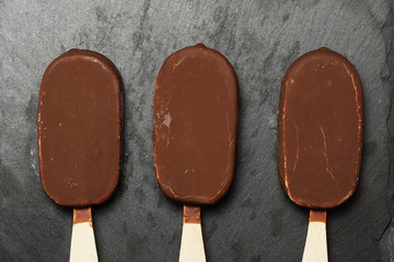 Chocolate ice cream dark slate background. flat lay. gastronomic food