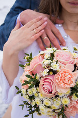 bride and groom holding hands