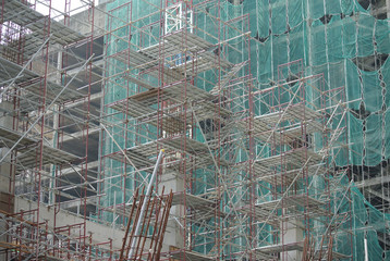 JOHOR, MALAYSIA -APRIL 13, 2016: Scaffolding used as the temporary structure to support platform, form work and structure at the construction site. Also used it as a walking platform for workers. 
