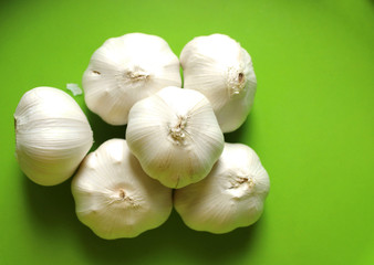 fresh garlic on a green background
