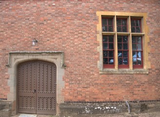 Fototapeta na wymiar old brick wall with windows background