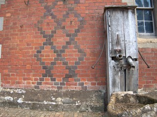 old brick wall with well background texture