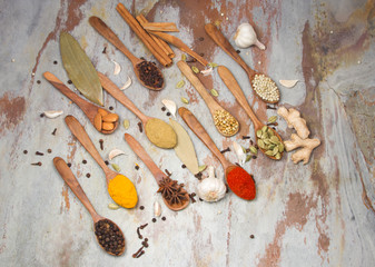 Aromatic spices on wooden spoons. Food ingradients.


