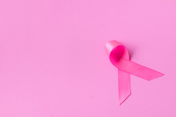 Pink ribbons on pink background