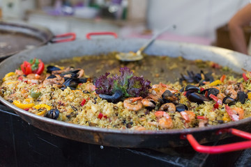 Street food on big fry pan. Hungarian Budapest  fest market, horizontal photo close up