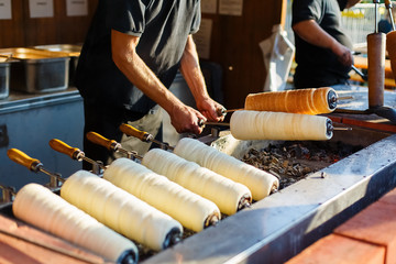 Fototapeta premium Hungarian traditional street food baking pastry kurtosh kalach or trdelnik