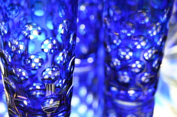 Close-up of blue shiny drinking glasses.