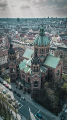 Aerial view of St. Lukas church and in the background Munich City in Bavaria, Germany.
