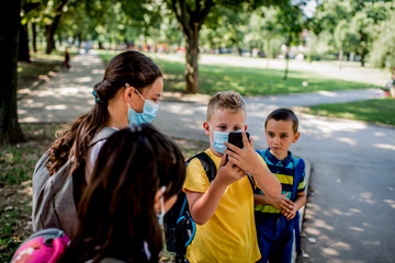 Children are going to school with protective face masks