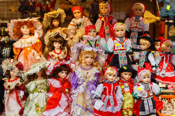 Fototapeta na wymiar Small Pretty baby girl dolls for sale in market in Praha Czech Republic