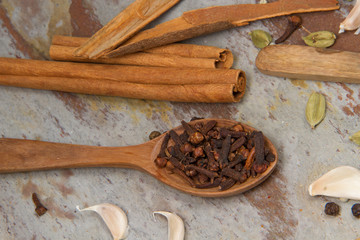 Aromatic spices on wooden spoons. Food ingradients.



