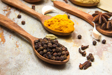 Aromatic spices on wooden spoons. Food ingradients.


