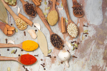 Aromatic spices on wooden spoons. Food ingradients.


