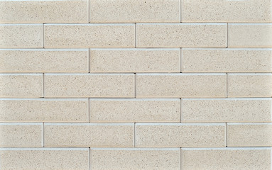 Texture of brick wall. new brickwork. Samples of wall or fence are presented at exhibitions. Gray brick close up.