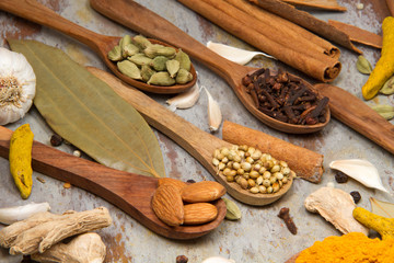 Aromatic spices on wooden spoons. Food ingradients.


