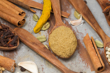 Aromatic spices on wooden spoons. Food ingradients.


