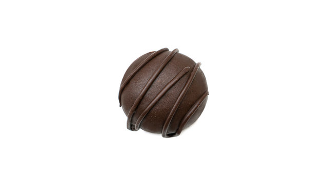 Delicious, round, chocolate candy with nuts on a white background. High quality photo