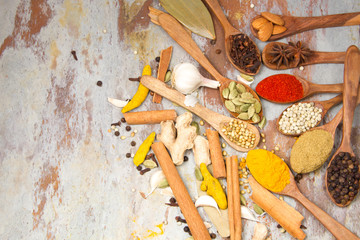 Aromatic spices on wooden spoons. Food ingradients.


