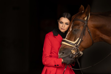 Sensual photo young woman rider and horse, concept of mutual understanding of girl and animal, antistress therapy