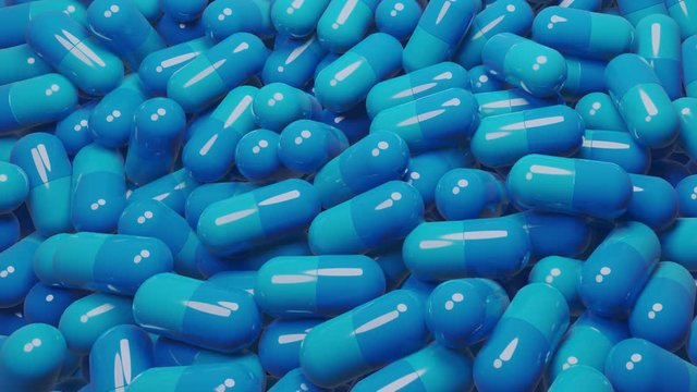 Close up of many blue pills capsules. Medicine and pharmacy concept.,3D Animation.