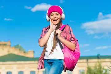 Keep calm and listen on. Happy kid listen to music sunny outdoors. Learning language. Listening comprehension skills. English school. Musical education. Courses available on audio