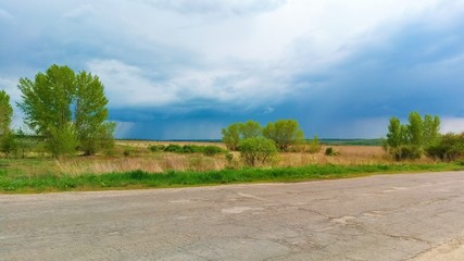 Fototapeta na wymiar road in the countryside before the rain