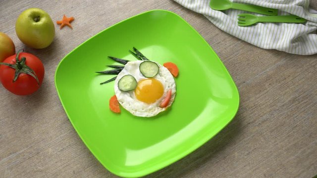 A funny picture of scrambled eggs on a plate. Making Healthy Breakfasts Fun with Funny Food. Adorable Kids Snack