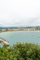 view of the city of San Sebastian, with La Concha beach, from Mount Urgull. Summer vacation scene in Spain