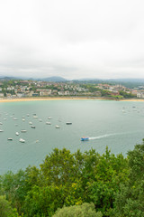 Holiday, view of the city of San Sebastian, with La Concha beach, from Mount Urgull. Summer vacation scene in Spain