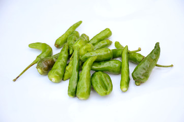 bunch bunch the green ripe chilly isolated on white background.