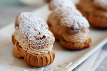 Classic French dessert eclair, choux pastry with soft hazelnut cream