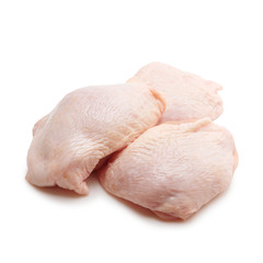 Three raw chicken breasts with skin