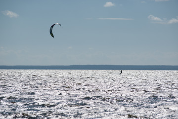 Kitesurfer accelerated in strong wind