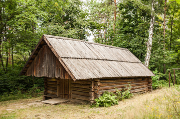Old authentic wooden house with logs