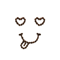 Image of a smiley face from the eyes of hearts with a smile with a tongue made of many coffee beans