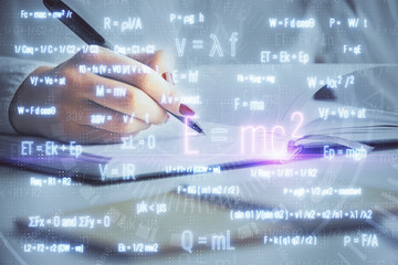 Science formula hologram over woman's hands taking notes background. Concept of study. Multi exposure