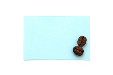 Mockup of blue notes and coffee beans isolated on a white background