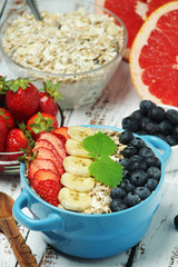 Healthy diet breakfast including cereal with berry and fruits	