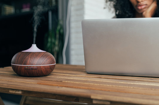 Young Black Woman Using Laptop At Home